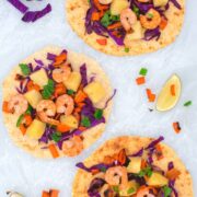 grilled shrimp with pineapple salsa on corn tortilla