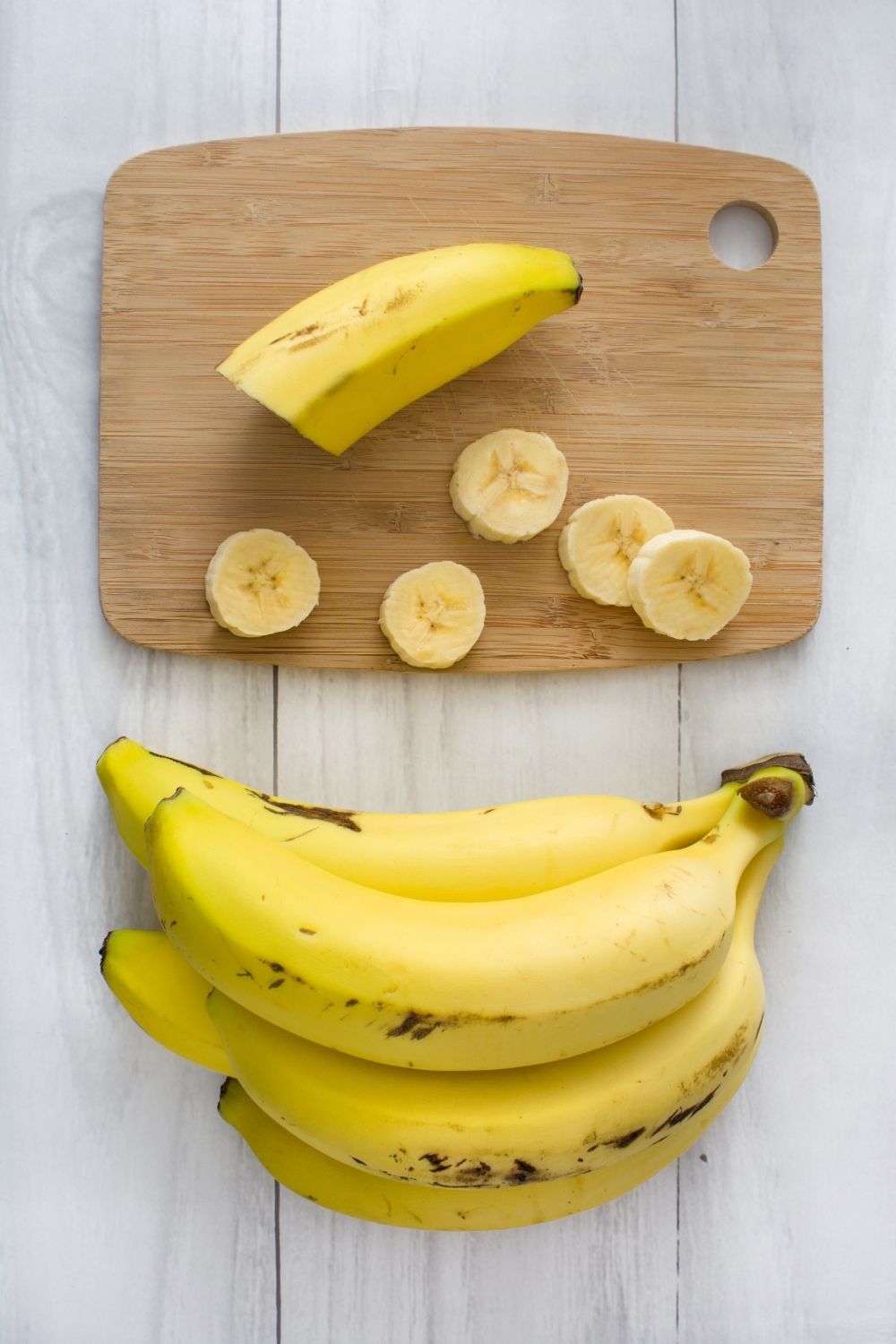 ripe bananas on cutting board