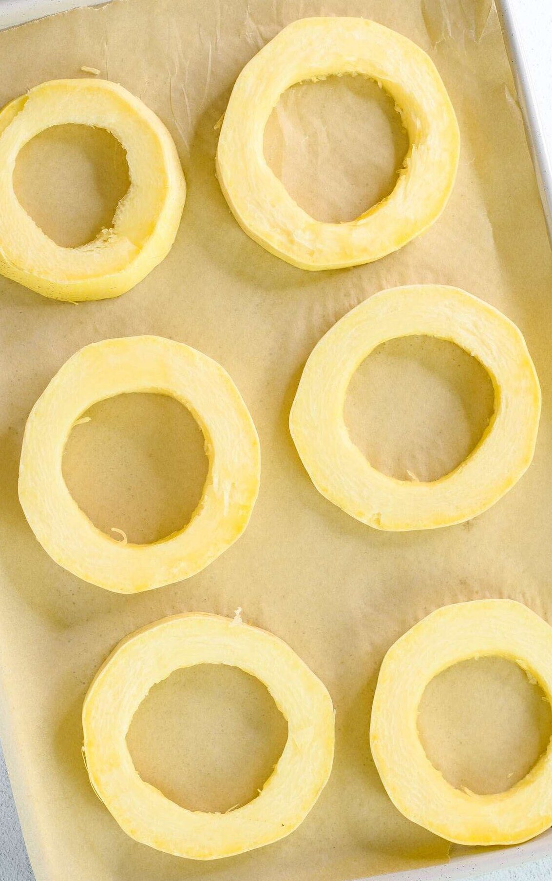 spaghetti squash rings on baking sheet
