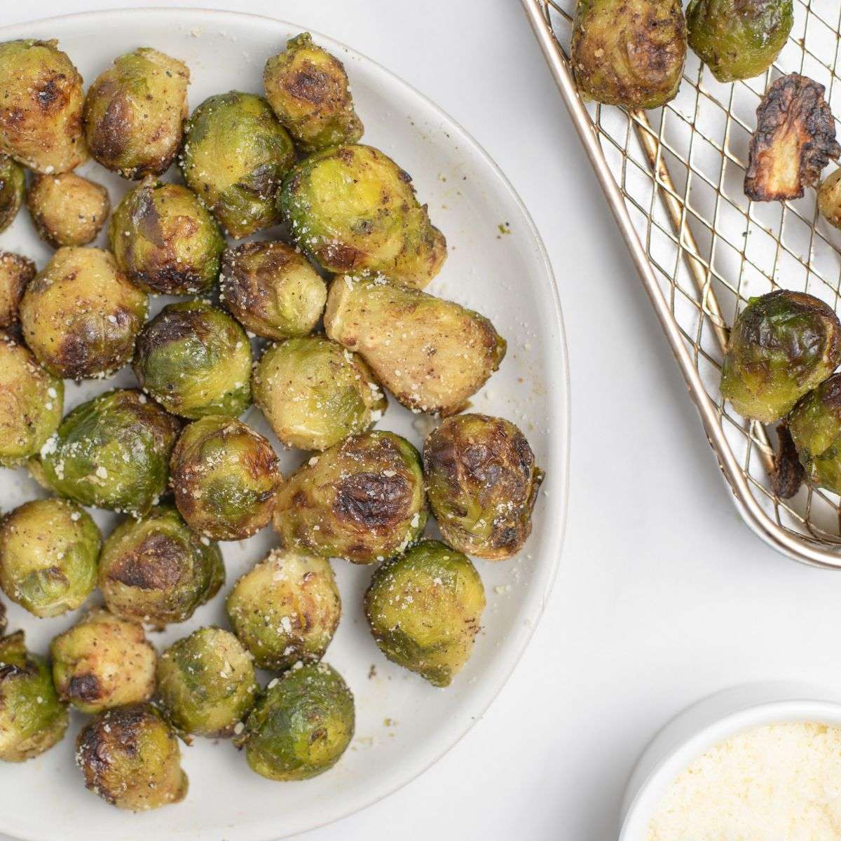 frozen brussels sprouts on plate with sprinkled parmesan