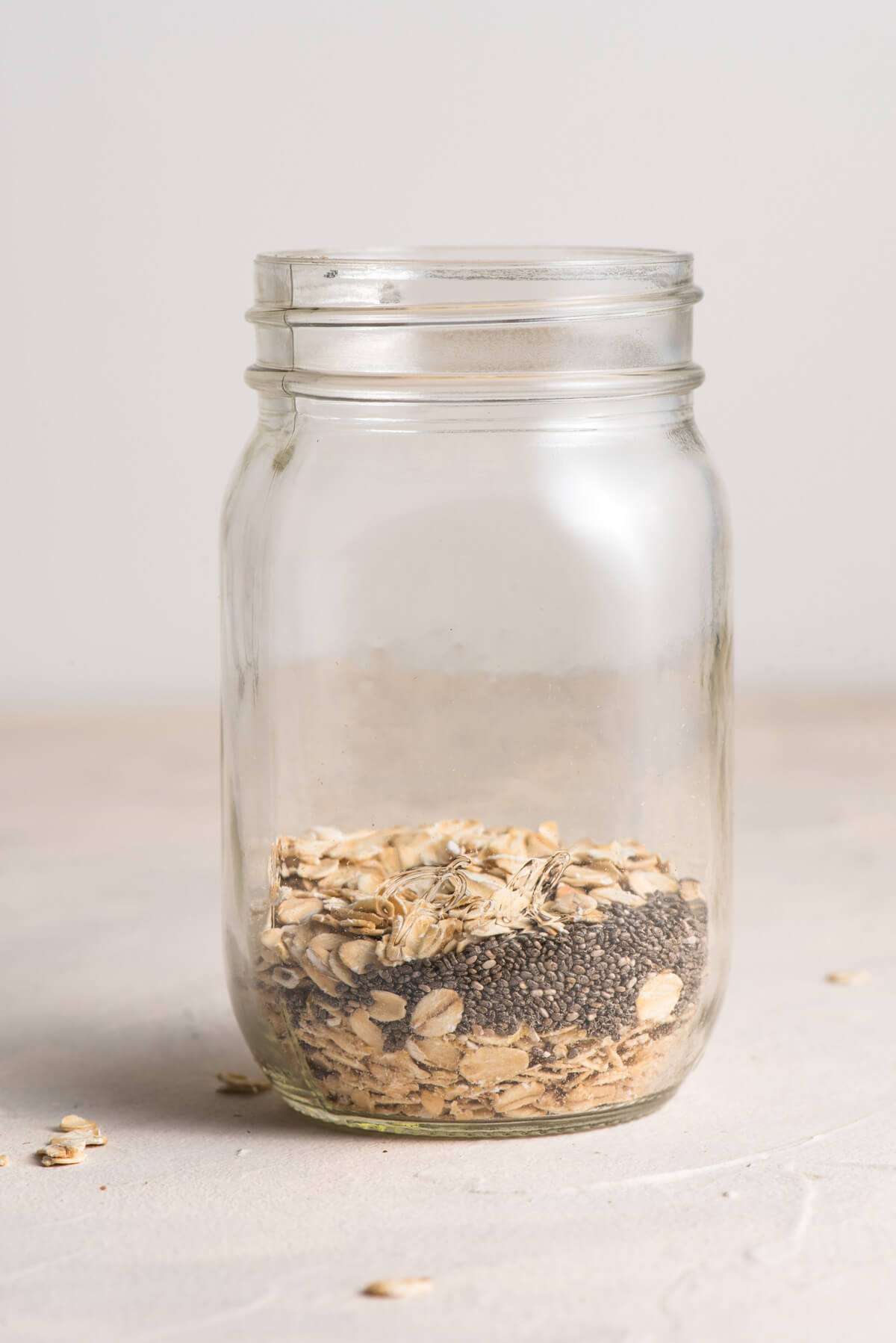 mason jar filled with oats, and chia seeds.