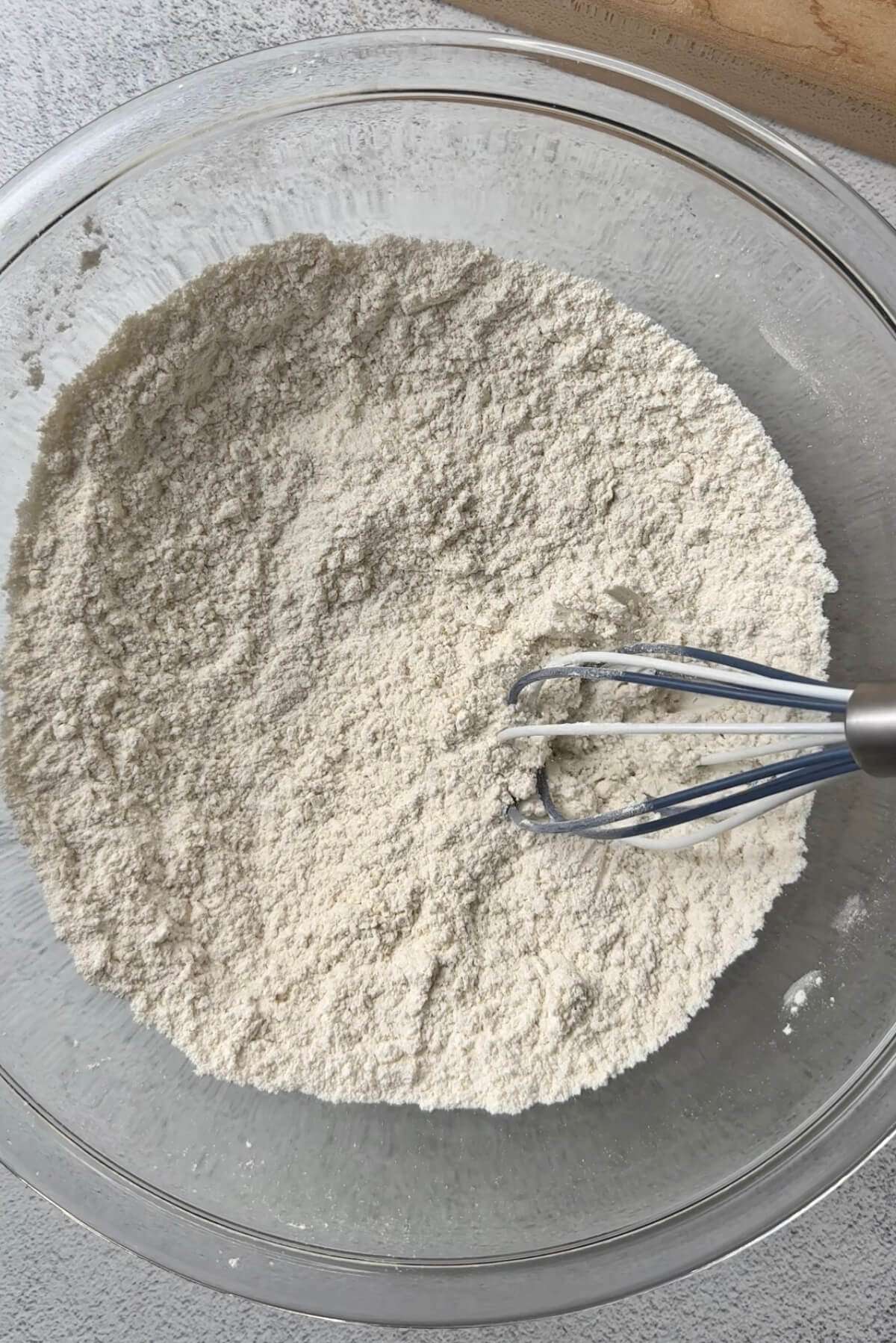 flour, baking powder, and salt in a clear mixing bowl with whisk