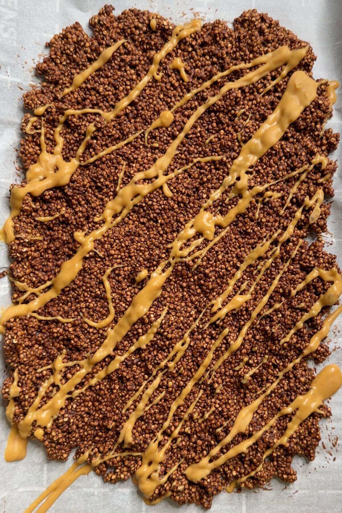 chocolate quinoa spread on baking sheet with peanut butter