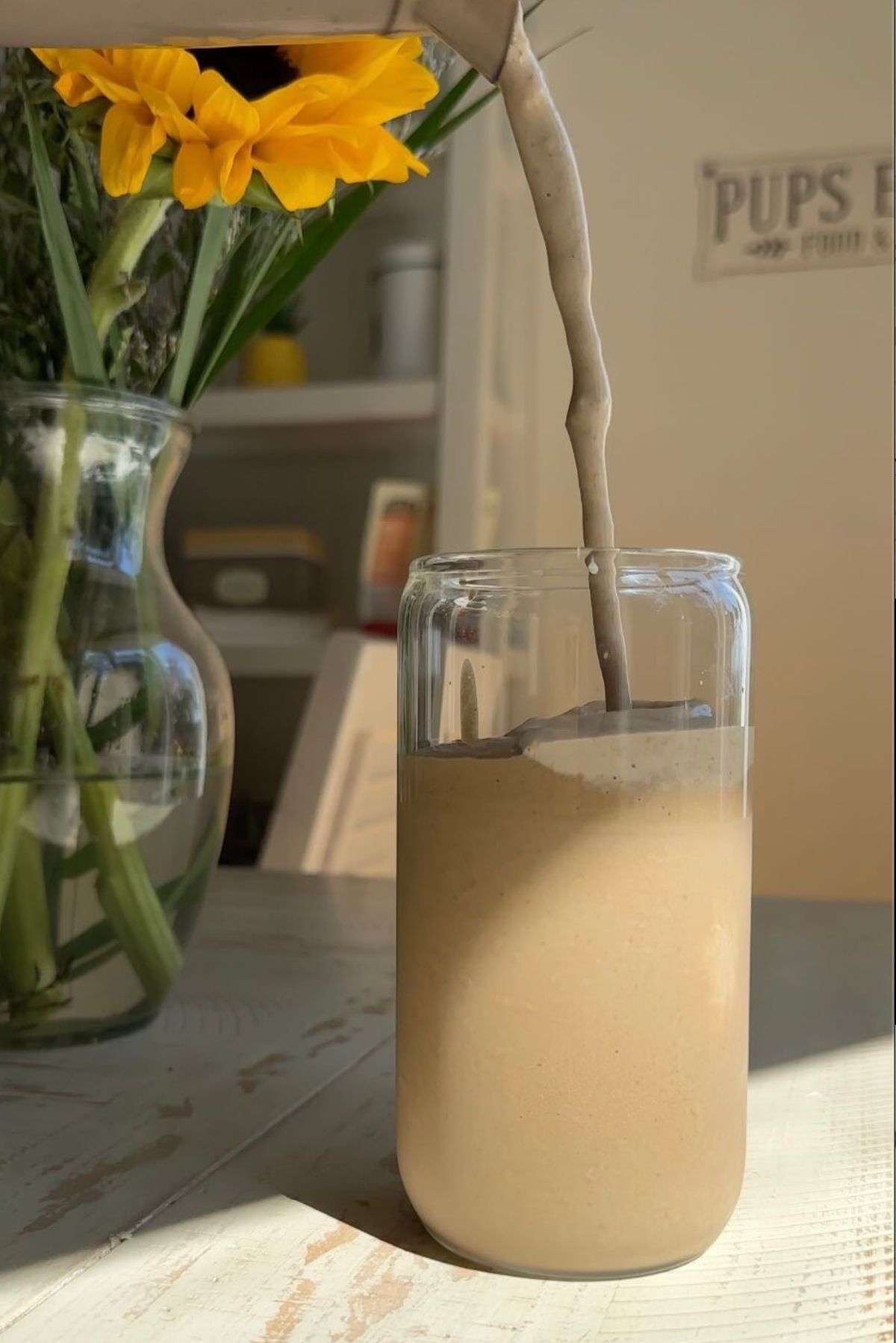 chocolate cauliflower smoothie being poured into cup